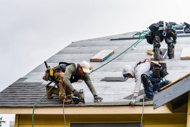 Professional Roofing technician working in Huntington Mills, PA